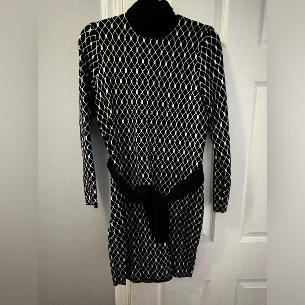 Black sweater dress with matching belt. Size Medium